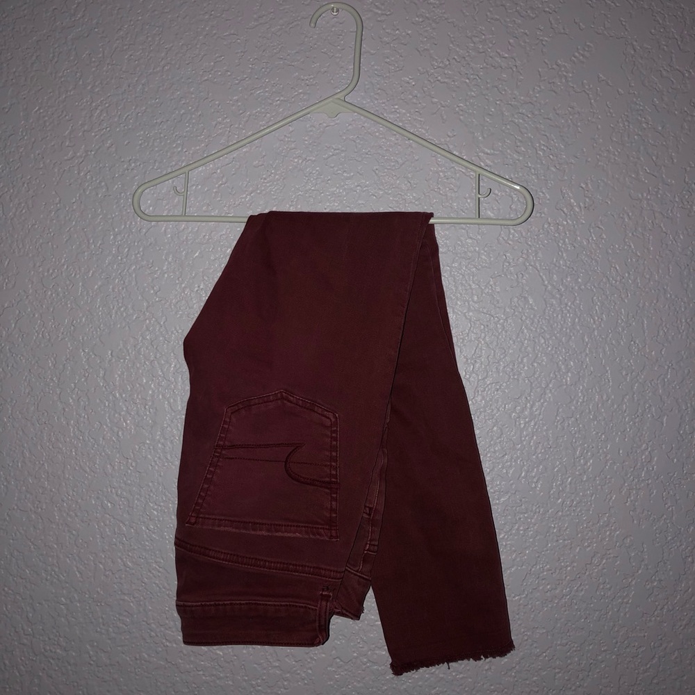 AE skinny maroon jeans